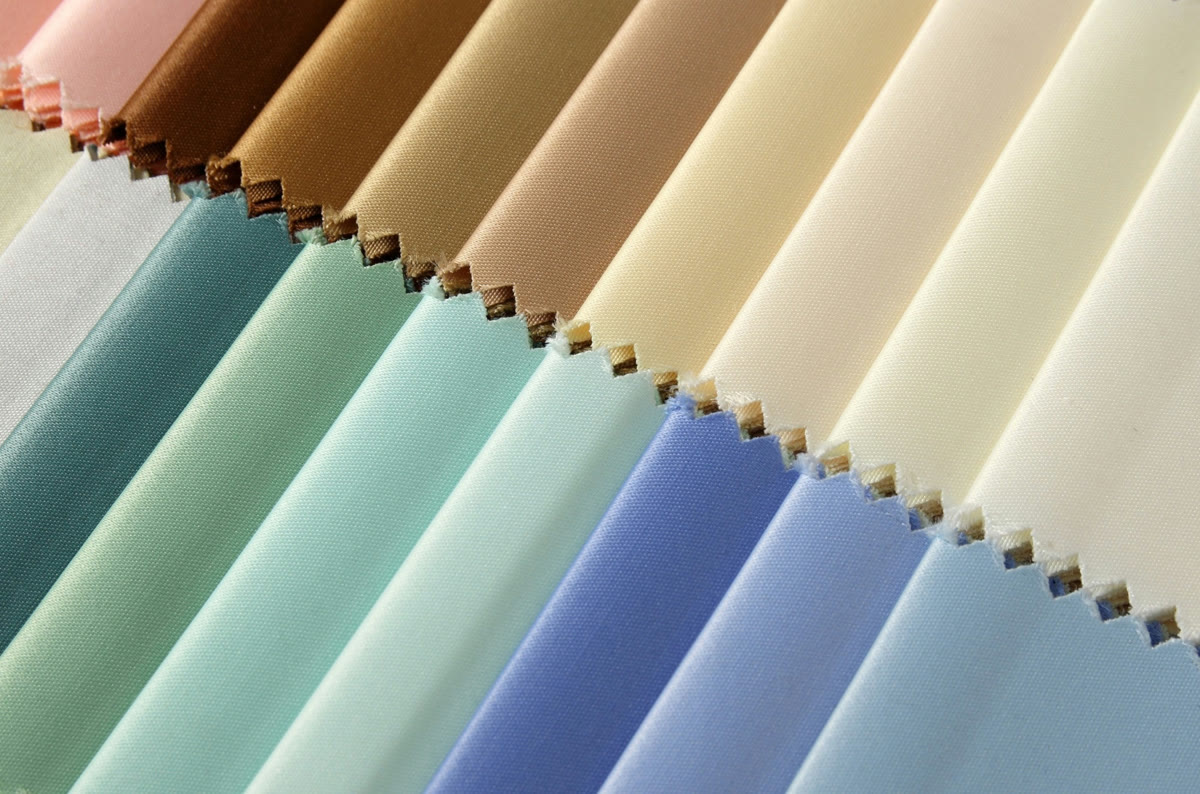 Close-up of blind fabric samples in many colours
