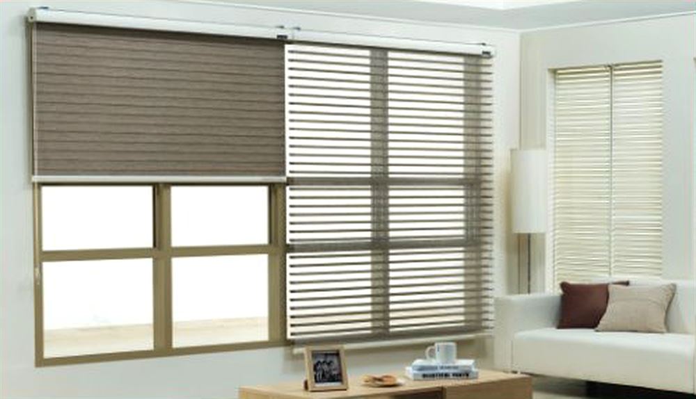 Triple shades on a living room window